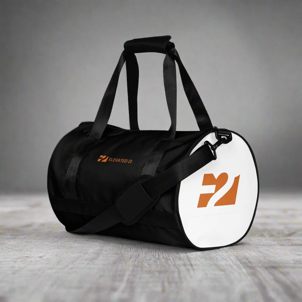 Black and white gym bag with the word ELEVATED 21 Embroidered in orange on the side